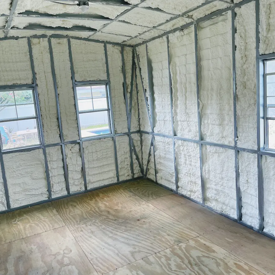 Closed-cell spray foam insulation applied to wall cavities in a residential project in Moline